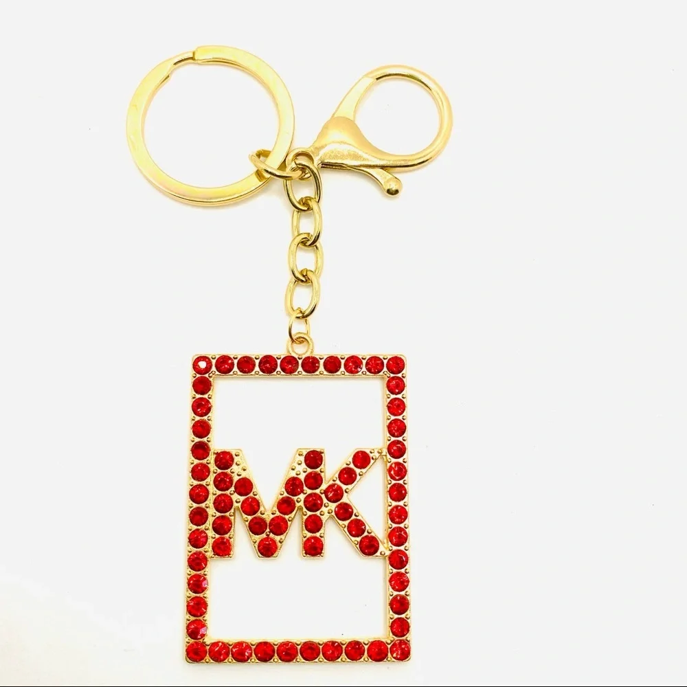 Purse Charm Key Chain MK in Red Crystals set in golden tone.